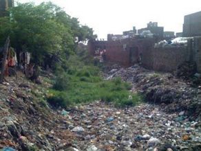 Dumping of Garbage in open drain passing through Bangla Basti