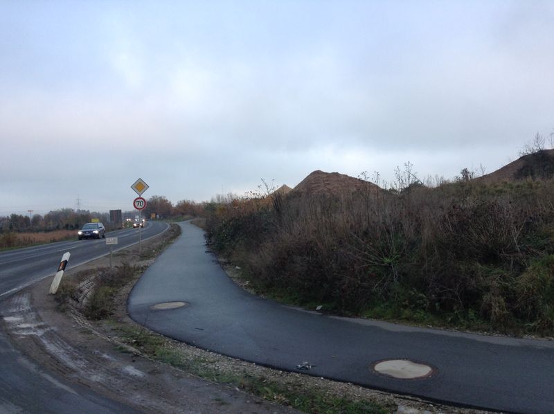File:The site as seen from the approach road (A73).JPG